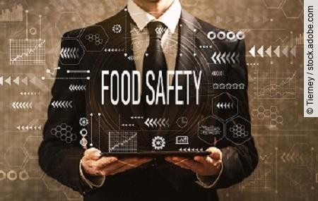 Food safety with businessman holding a tablet computer